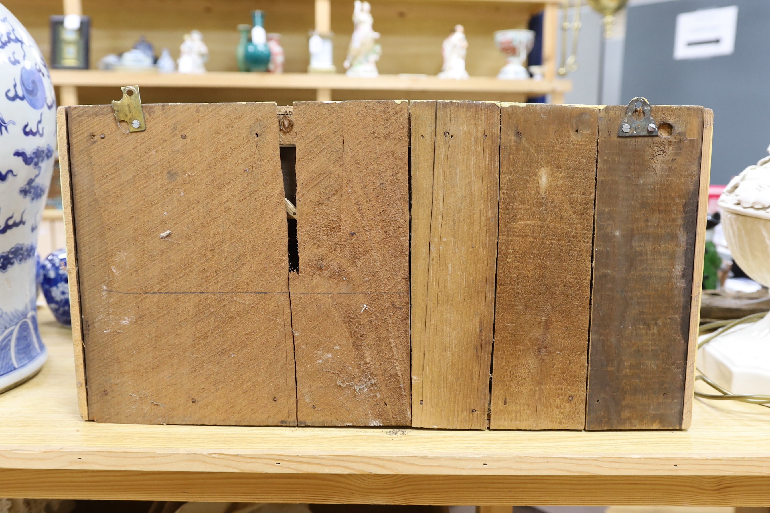 An early 20th century painted nine drawer spice hanging cupboard, 62cms wide, 31cms high
